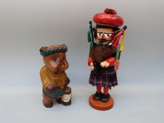 Steinbach wooden bagpiper puppet (40cm tall) together with a carved wooden model of a pig golfer,