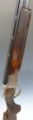 Browning B2 12 bore over and under shotgun with engraved scenes of birds to the lock,