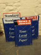 Approximately twelve newspaper advertising signs for Malmesbury Standard and Stroud News and