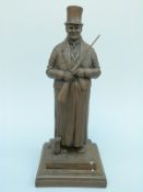 A bronzed figure holding a gun 'The Bishop of Bond St 1815-1871' by David Hughes,