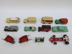 Twelve Dinky Toys diecast model vehicles and accessories including Shell van,