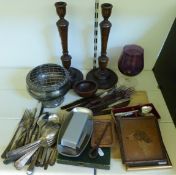 A pair of wooden candlesticks a wooden plaque depicting a dog, silver plate,