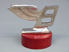 A Bentley winged B car mascot,