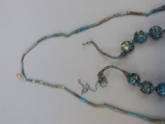 An ancient Egyptian faience beaded necklace and another similar,