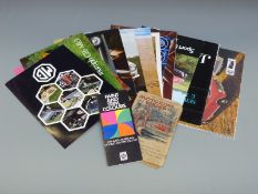 A collection of collectable car brochures including Jaguar E Type, Triumph TR6, MGB,
