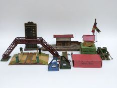 Twelve Bing and Hornby 0 gauge buildings and accessories including a Train Indicator, Station,
