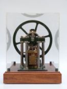 James Booth's rectilinear model live steam stationary engine in display case,