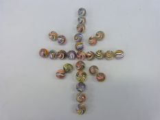 Twenty seven glass marbles, all with multicoloured twists,