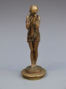 A vintage car mascot formed as an Art Deco girl clad in a robe,