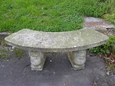 A reconstituted stone / concrete carved garden seat