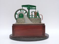 A scratch built model beam engine with electric motor in base to demonstrate,