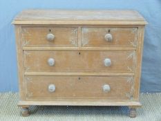 A pine chest of two over two graduated drawers with engraved decoration (H78 x W98 x D45cm)
