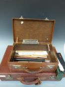Two leather suitcases and a collection of drawing instruments