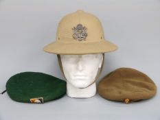 Two military berets comprising an American Green Berets and a British Royal Artillery example,
