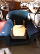 An upholstered armchair and a footstool