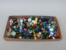 A collection of glass marbles of various sizes,