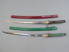 Two Samurai swords with decorative guards and lacquered scabbards, blade length 73cm,