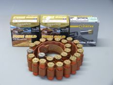 One-hundred 12 bore shotgun cartridges together with a 12 bore canvas and leather cartridge belt.