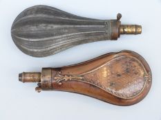 Two 19thC powder flasks one copper and brass with embossed decoration the other base metal and