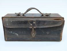 A military motorcycle tool box with embossed date 1943 and ministry arrow,