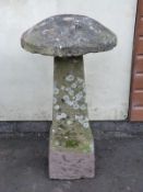 A natural stone staddle stone,