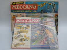 Two Meccano outfits, Power Drive Set M and Highway Vehicles Set 3,