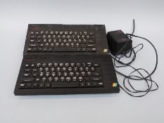 Two Sinclair ZX Spectrum+ vintage computers.