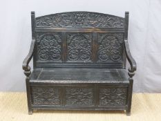 A 19thC carved oak settle (H121 x W125 x D56cm)