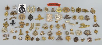 A collection of various military badges to include Derbyshire,