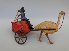 Lehmann tinplate Africa Ostrich Mail Cart with an ostrich pulling a man on red mail cart whose arms