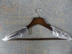 Approximately 100 new retail type coat hangers with non slip shoulders and trouser bar below