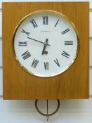 Jantar Russian wall clock with white Roman dial,