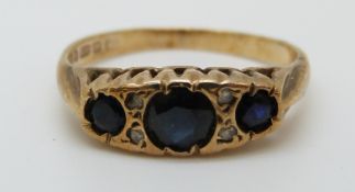 A 9ct gold ring set with sapphires and diamonds (size J)