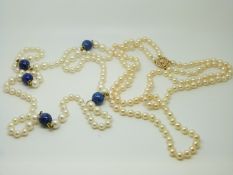 A two strand pearl necklace with a 14ct gold clasp and a pearl necklace set with lapis lazuli beads