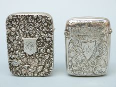 Two Victorian hallmarked silver vesta cases, one with floral repoussé decoration,