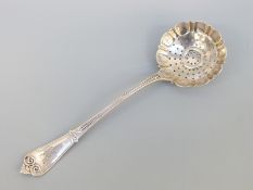 A Tiffany & Co white metal sifter or strainer spoon, stamped Tiffany & Co sterling,