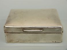 A hallmarked silver cigarette box, marks rubbed,