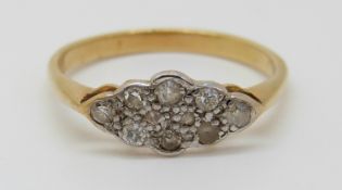 An 18ct gold ring set with diamonds in a platinum setting, 2.