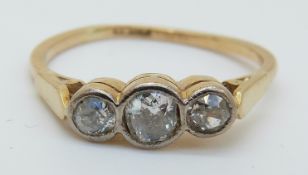 An 18ct gold Victorian ring set with three old cut diamonds (size M)