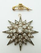 A Victorian star pendant set with a large old mine cut diamond measuring approx 1ct surrounded by