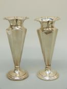 A pair of Victorian hallmarked silver tapering octagonal vases.