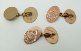 A pair of 9ct gold cuffinks with foliate design and another cufflink (7.