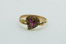 A Victorian ring set with seed pearls and rubies in a heart shape, 1.
