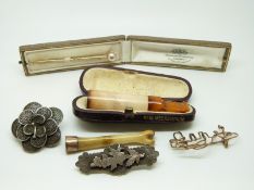 A Victorian hallmarked silver brooch with applied swallow and foliate decoration,