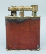 A large plated and leather effect table lighter with various patent marks for European countries