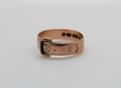 A 9ct rose gold buckle ring, 2.