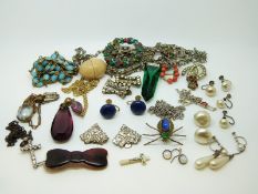 A collection of jewellery in a tooled leather box including spider brooch, faux pearl earrings,