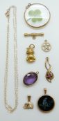 A 9ct gold pendant, a yellow metal pendant set with an amethyst,