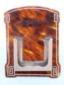 A hallmarked silver and tortoiseshell piqué work easel backed perpetual calendar frame,