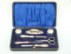 A cased early 20thC hallmarked silver manicure set